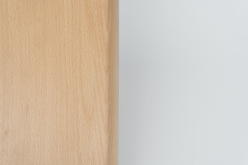 Close-up of a light brown wooden panel isolated against a plain white background. Suitable for design mockups, product presentations, or backgrounds with a clean, minimal wood elements.