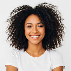 Young curly pretty happy generation z African American woman wearing t-shirt standing isolated on white background. Smiling positive cute ethnic female model looking at camera, close up portrait