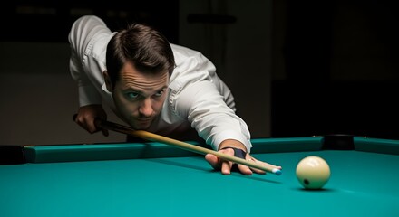 Concentrated man taking a precise shot in a dimly lit billiards hall.