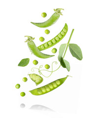 Green peas and pods falling on white background