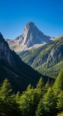 Majestic mountain peak over a lush green forest valley