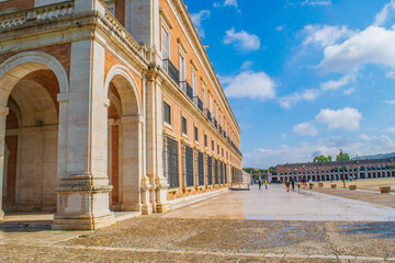 Wide view of the Royal Palace of Aranjuez with its grand architecture and manicured pathways in Spain.
