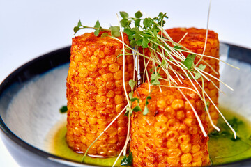 Deliciously Grilled Corn Stacks with Fresh Microgreens in a Flavorful Herb Sauce for a Vibrant...