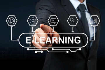 Businessman in Suit Pointing at E-Learning Concept with Icons of Technology and Digital Education Against Dark Background in Modern Office Setting