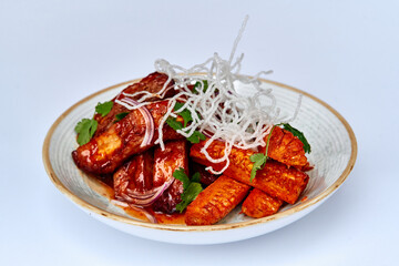 A Delicious Plate of Grilled and Glazed Sweet Potatoes with Garnishes of Fresh Herbs and Crispy Onions for a Tantalizing Culinary Delight
