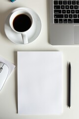 A top-down shot of workspace with wireless mouse, keyboard, coffee, and sketchpad—minimalist tech setup