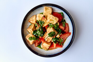 Deliciously Crafted Tofu Dish with Fresh Tomatoes and Herbs, Perfectly Seasoned for a Healthy and Flavorful Meal Experience