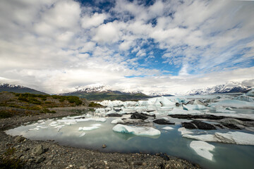 Glacier Lagoon with Icebergs and Snowy Peaks