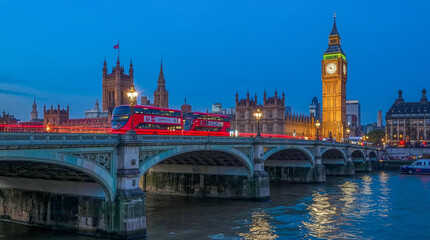 Fototapeta premium Iconic London skyline at dusk featuring Big Ben, the Houses of Parliament, and Westminster Bridge with a red double-decker bus creating light trails.