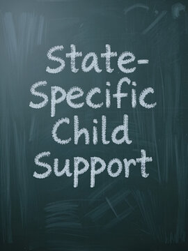 Financial concept meaning State-Specific Child Support with inscription on chalkboard.
