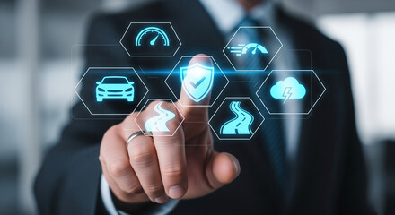 A businessman interacts with a futuristic digital interface featuring a central shield icon surrounded by automotive and driving related symbols, signifying vehicle safety and smart car technology.
