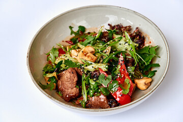 A Colorful and Flavorful Beef Salad with Fresh Vegetables and Herbs, Perfectly Mixed for a Delicious Meal Option Packed with Nutrients and Taste