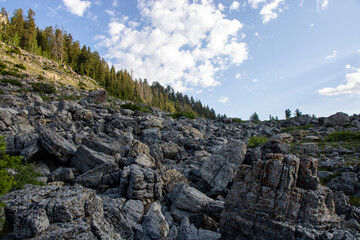 Scenic Mountain Landscape in Peter Sinks, Utah – Alpine Meadows, Rocky Hills, and Pine Forest Under a Blue Sky