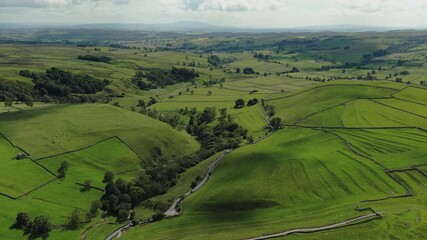 Stunning Aerial Drone View of Yorkshire Dales Landscape, Malham, and Rolling Green Hills at Daytime