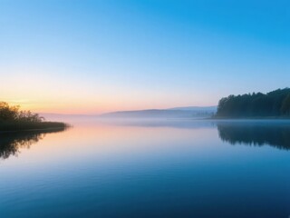 Fototapeta premium Calm Lake at Dawn with Mist and Reflections