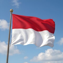 A red and white flag with a pole. The flag is waving in the wind. The sky is blue with some clouds. Indonesian flag. Indonesian Independence Day. 