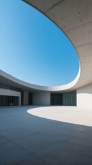 Obraz premium Modern Architectural Courtyard with Curved Overhang and Clear Sky