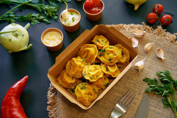 Delicious Platter of Homemade Dumplings Served with Fresh Herbs, Spices, and Accompaniments for a Flavorful Culinary Experience