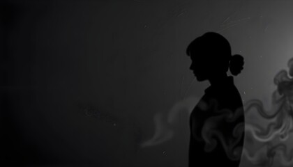 Contemplative woman in shadow artistic studio black and white creative atmosphere