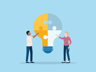 Teamwork and Collaboration Concept with People Assembling a Lightbulb Puzzle