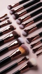Assortment of professional makeup brushes arranged in an aesthetic layout