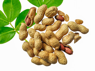 Ripe brown peanuts most delicious snacks with green leaves isolated on a white background.