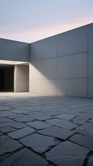 Fototapeta premium Modern Concrete Wall and Stone Pavement at Dusk