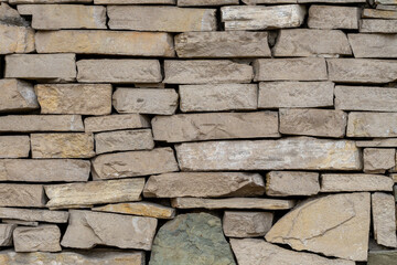 Rough Structure Stone Wall Background Texture. Large stone wall.