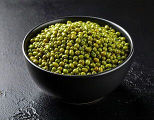a bowl of mung bean isolated on a black background