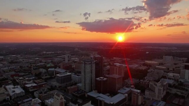 The sun sets over the cityscape of birmingham, alabama