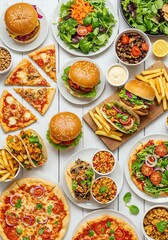 Assorted Fast Food Meals with Burgers Pizza Salads Fries and Desserts on White Table