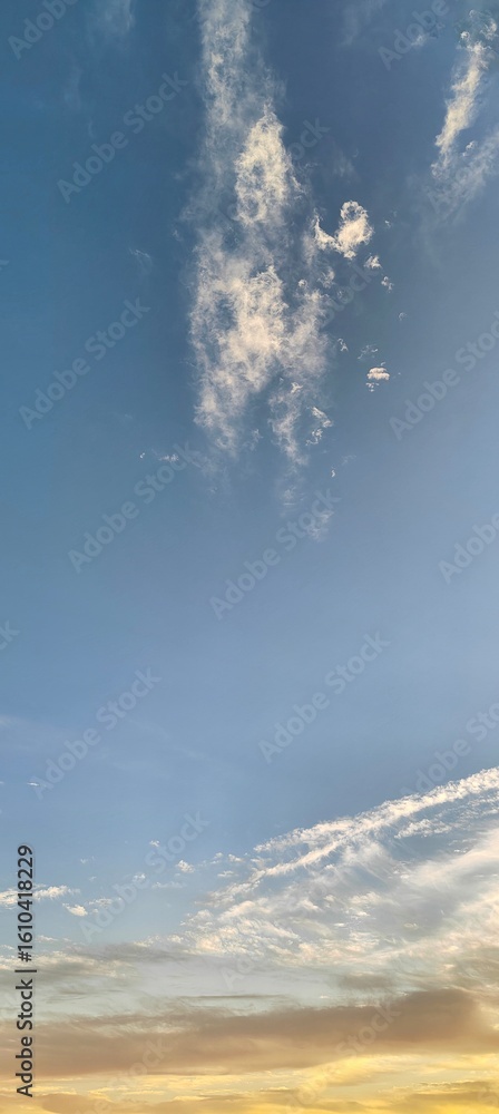 Wall mural gorgeous view of clouds on the horizon. several irregular - shaped white clouds floating gently. nea