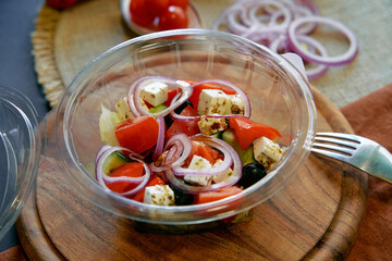 Fresh and Colorful Salad with Cherry Tomatoes, Cucumbers, Feta Cheese, Red Onions, and Black Olives...