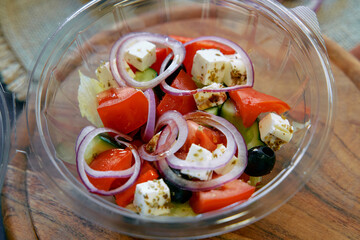 Fresh Mediterranean Salad Featuring Juicy Tomatoes, Crisp Cucumbers, Sliced Red Onions, Feta...