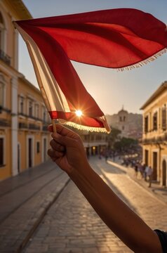 Hand Waving a Peruvian Flag in Lima during Fiestas Patrias
