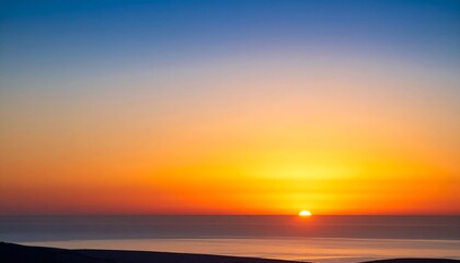 Obraz premium Majestic sunrise over the calm ocean with vibrant gradient colors