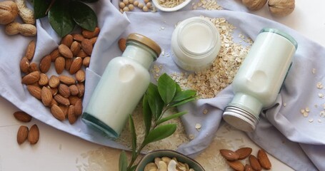 Alternative types of milks in glass bottles. Vegan non dairy milk