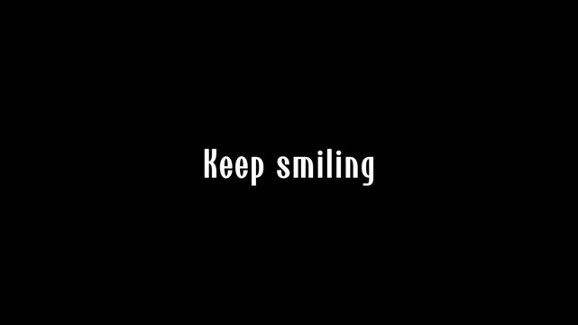 Minimalist inspirational quote keep smiling on black background.