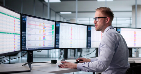 Professional Auditor Analyzing Medical Invoices On Computer Monitors