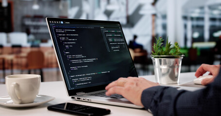Skilled Programmer Building Digital Worlds On Laptop