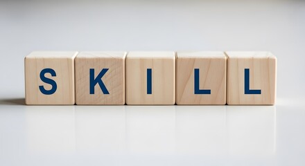 The word SKILL spelled out with wooden blocks on a reflective white surface. A concept of ability, expertise, training, knowledge, and personal development.
