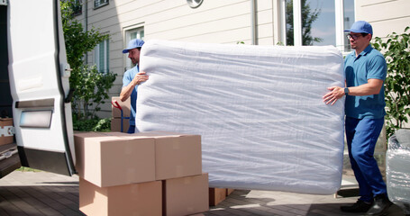 Efficient Movers Transport Mattress During Moving Day Delivery