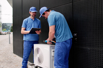 HVAC Technician Maintaining Air Conditioner