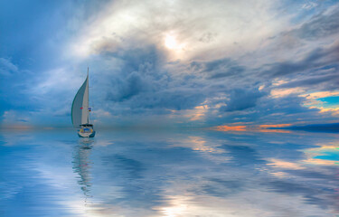 Lonely yacht sailing in the Mediterranean sea at amazing sunset - Sailing luxury yacht with white sails in the Sea.