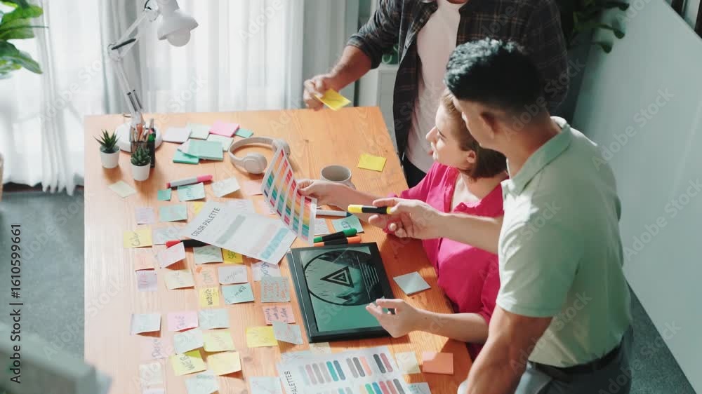 Poster close up of project manager working together brainstorming idea while looking at color palettes whil