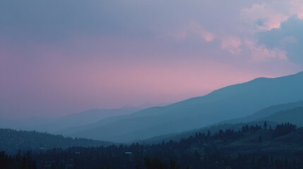 Obraz premium Misty mountain range at sunset