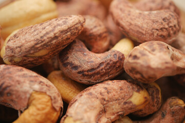 Cashews and peanuts in a mixed nut display at a market