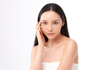 A beautiful young Asian woman with clean, fresh skin against a white background. Skincare, facial...