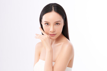 A beautiful young Asian woman with clean, fresh skin against a white background. Skincare, facial...