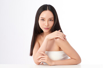 A beautiful young Asian woman with clean, fresh skin against a white background. Skincare, facial...